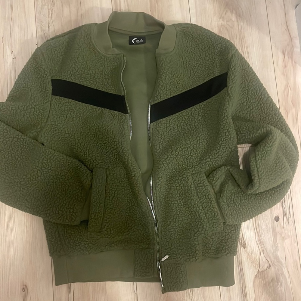 Dark green fleece jacket.